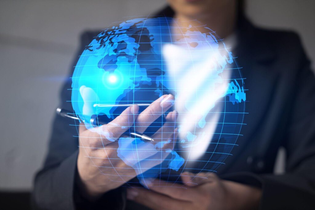 Businesswoman using smart phone in office. International business affairs with world map. Double exposure.